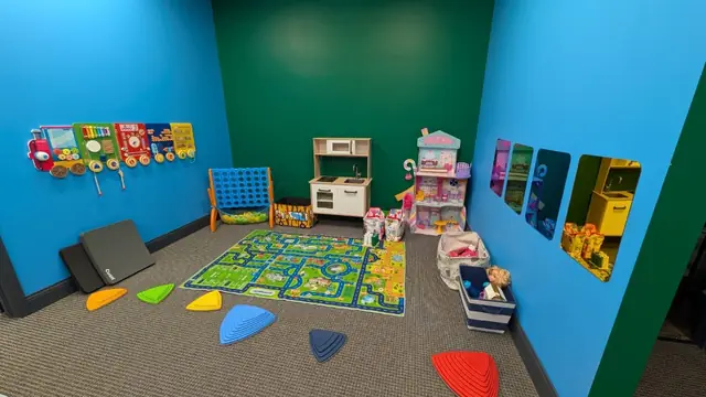 Play room with toys and kitchen set