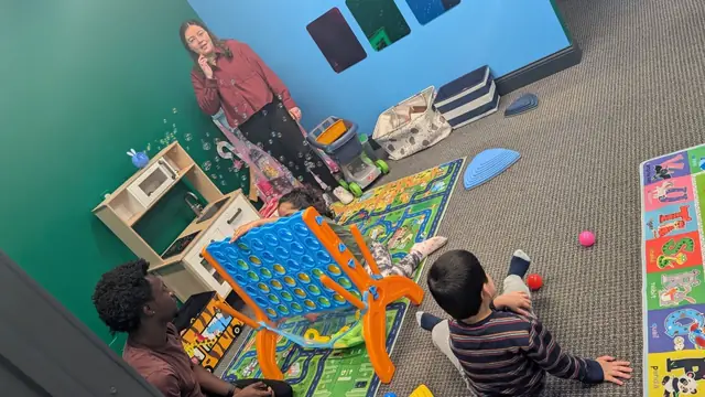 Staff and kids playing Connect 4